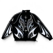 Back of A black zip-up jacket with a high collar, featuring a bold graphic design of white and silver flame-like patterns on the front and sleeves, and a decorative silver cross motif down the center front.