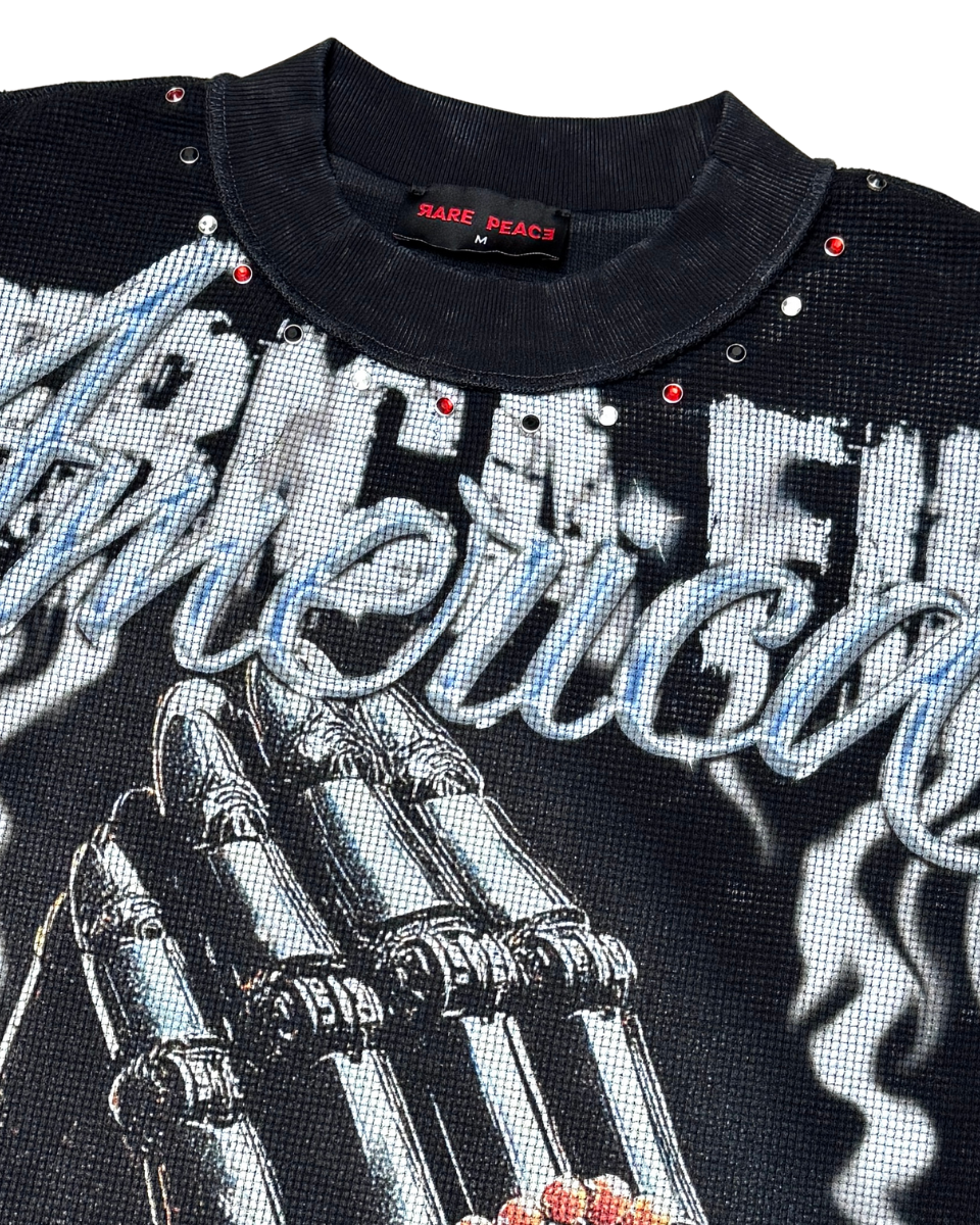 Black shirt with graphic design and text on a white background