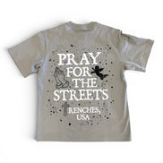 Beige t-shirt with text 'PRAY FOR THE STREETS RENCHES, USA' on a white background