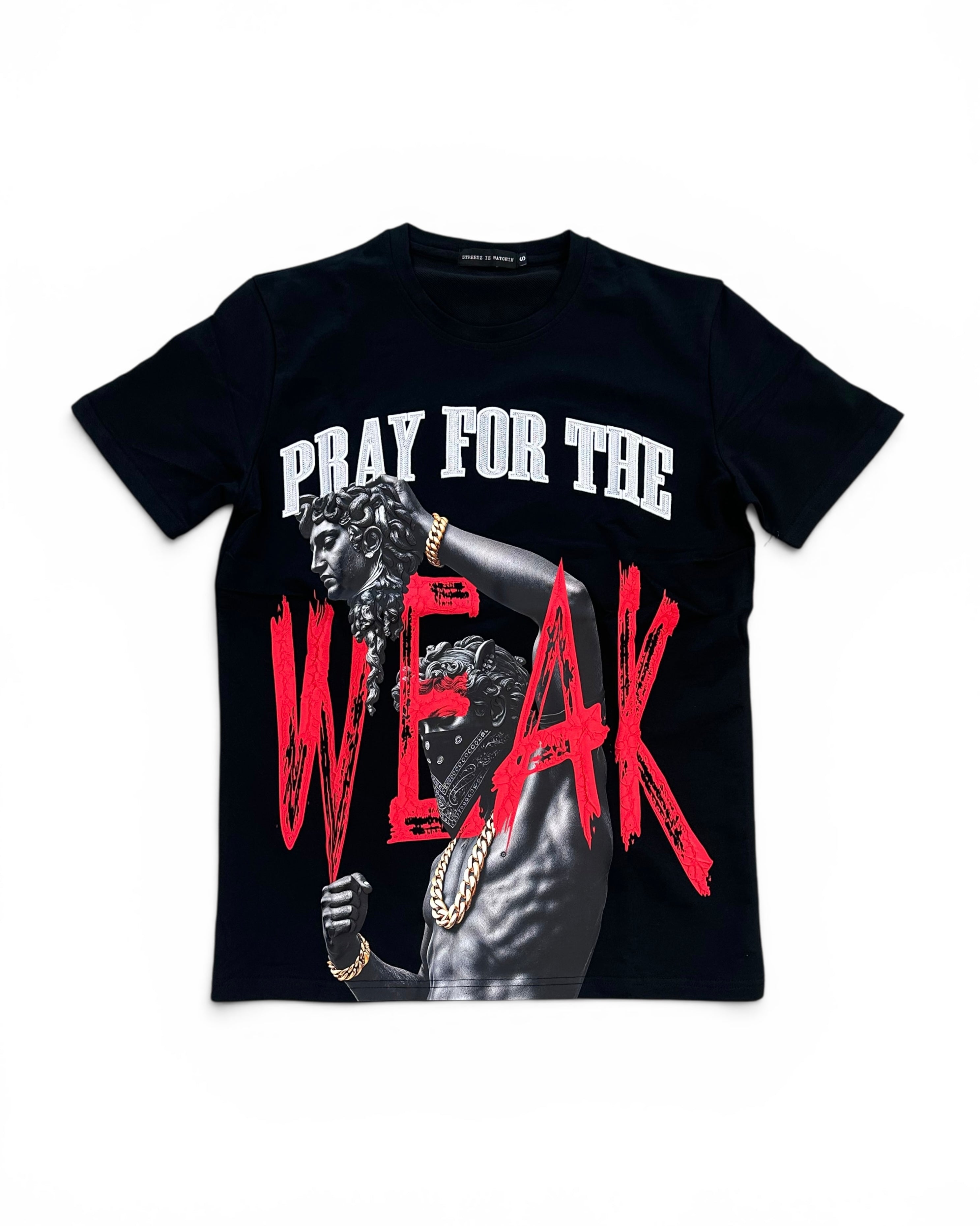 A black short-sleeve graphic t-shirt featuring a printed design of a man with gold chains and the text 'PRAY FOR THE WEAK' in white and distressed red lettering.