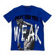 A royal blue short-sleeve graphic t-shirt featuring a printed design of a muscular statue with gold chains, the text 'PRAY FOR THE' in black, and 'WEAK' in large white brushstroke letters.