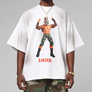 Person wearing a white t-shirt with a graphic design and text, standing against a gray background