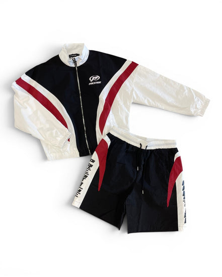 Black, white, and red tracksuit with a visible brand logo on a white background