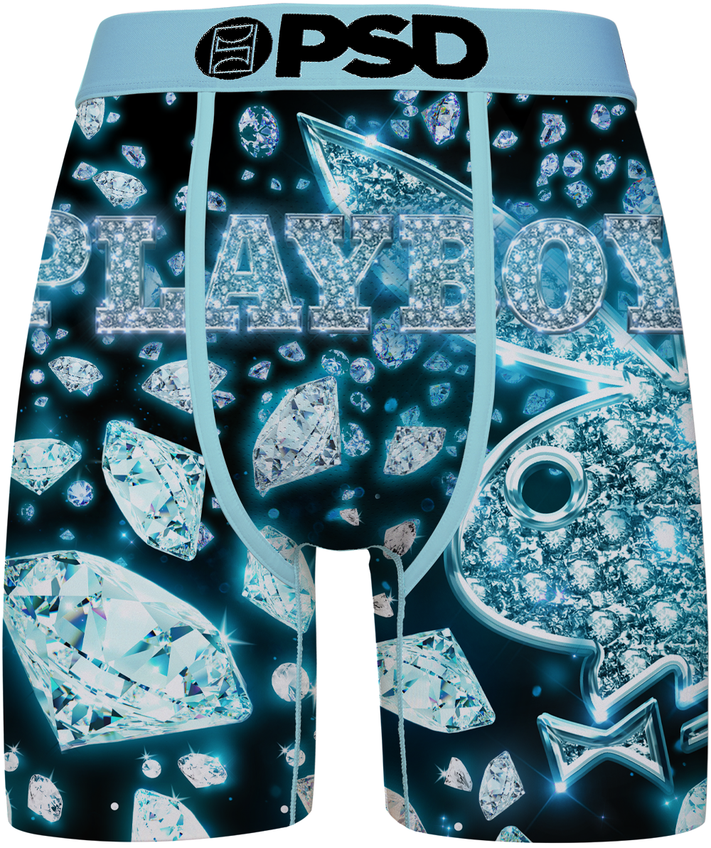 Men's boxer briefs featuring a dark blue and black background printed with sparkling diamond graphics and the word 'PLAYBOY' in a crystal-like font. The waistband is light blue with a black 'PSD' logo.
