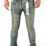 Distressed blue jeans with a visible brand label on a white background