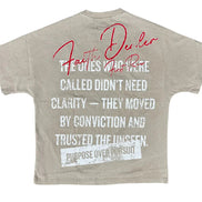 Beige t-shirt with motivational text on a white background