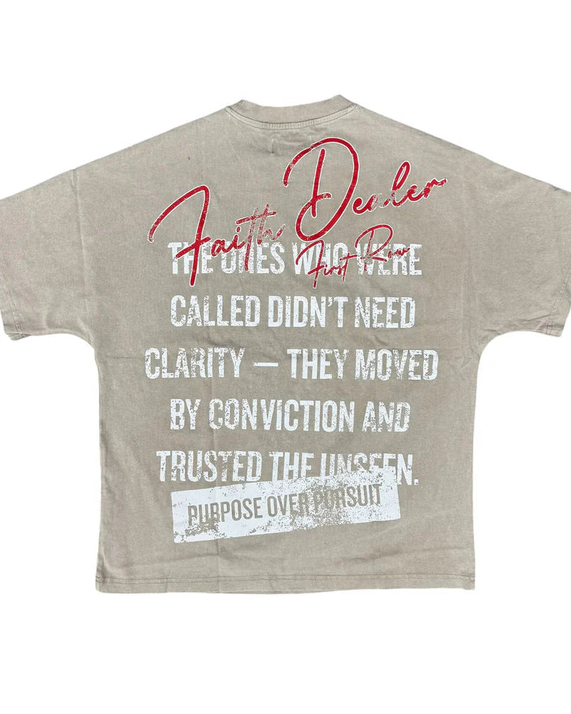 Beige t-shirt with motivational text on a white background