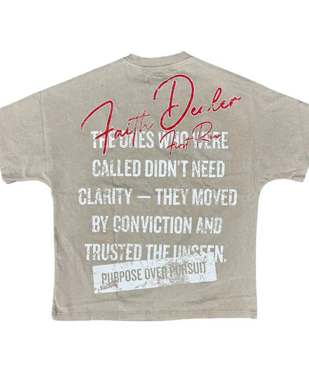 Beige t-shirt with motivational text on a white background