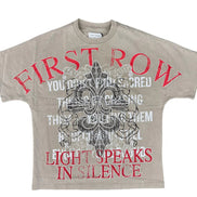 Beige t-shirt with red and black text and graphics on a white background