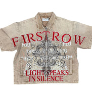 Beige shirt with red and black text and graphics on a white background