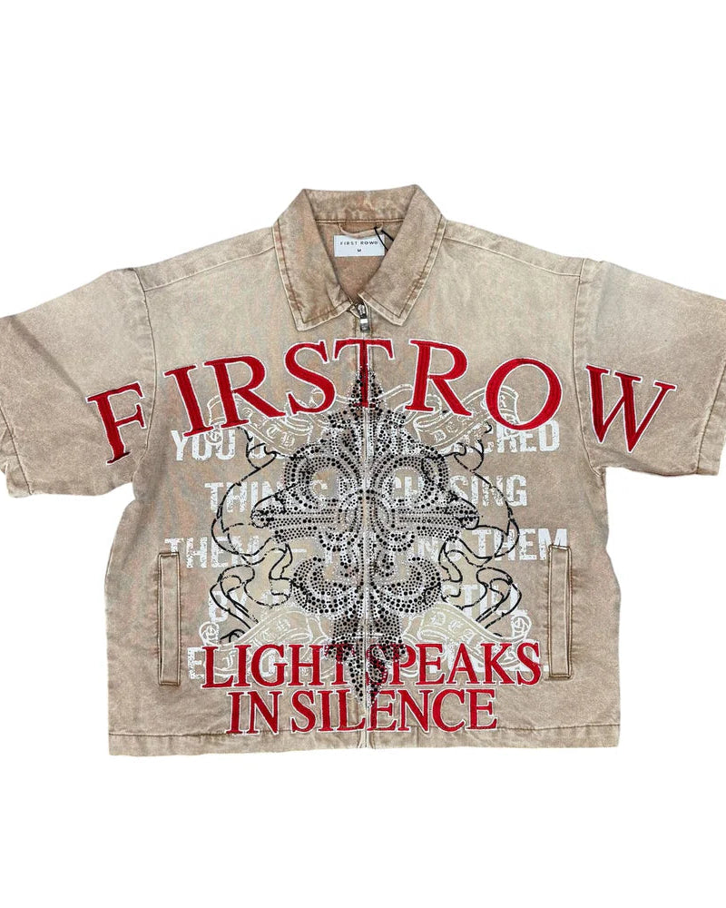 Beige shirt with red and black text and graphics on a white background