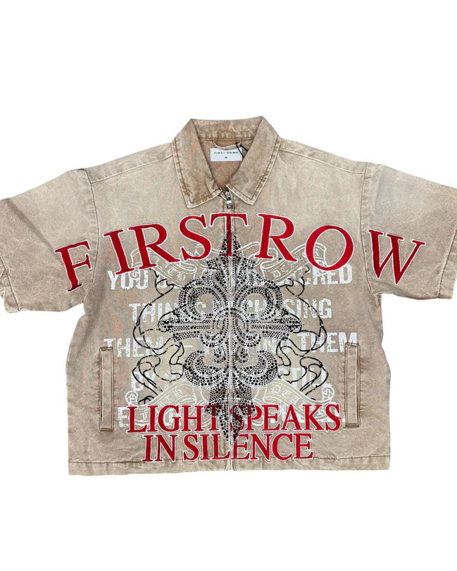 Beige shirt with red and black text and graphics on a white background