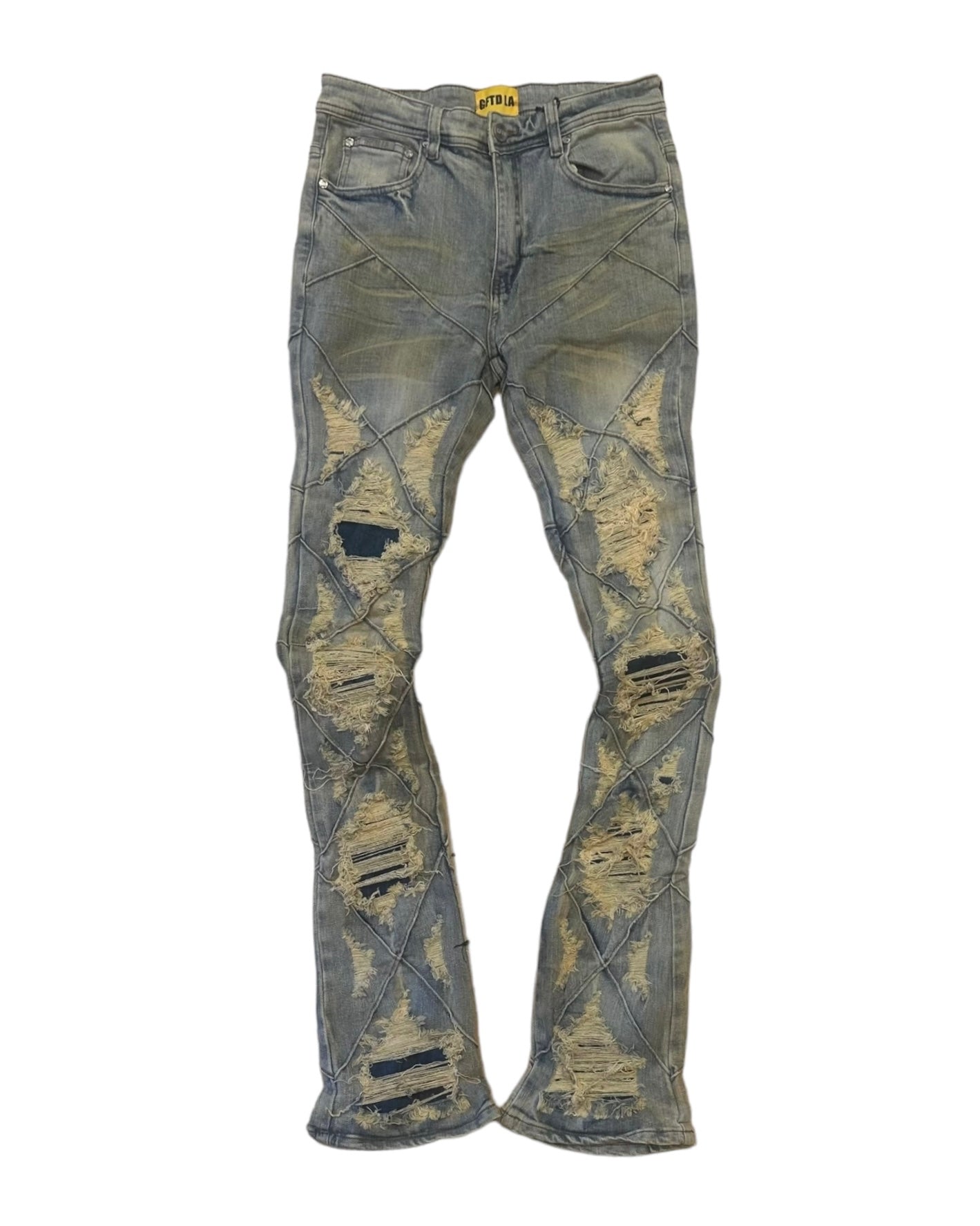 Front view of August Virgo denim showing the distressed rips and criss-crossed stitching. The vintage wash is evident in the coloration. 