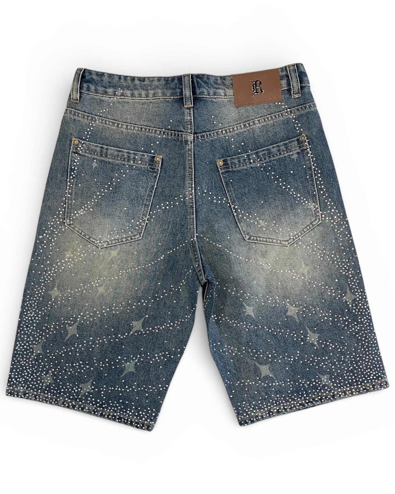 Blue denim shorts with star patterns on a white background