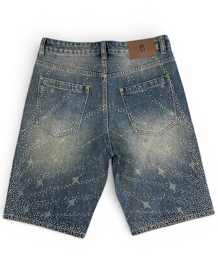 Blue denim shorts with star patterns on a white background