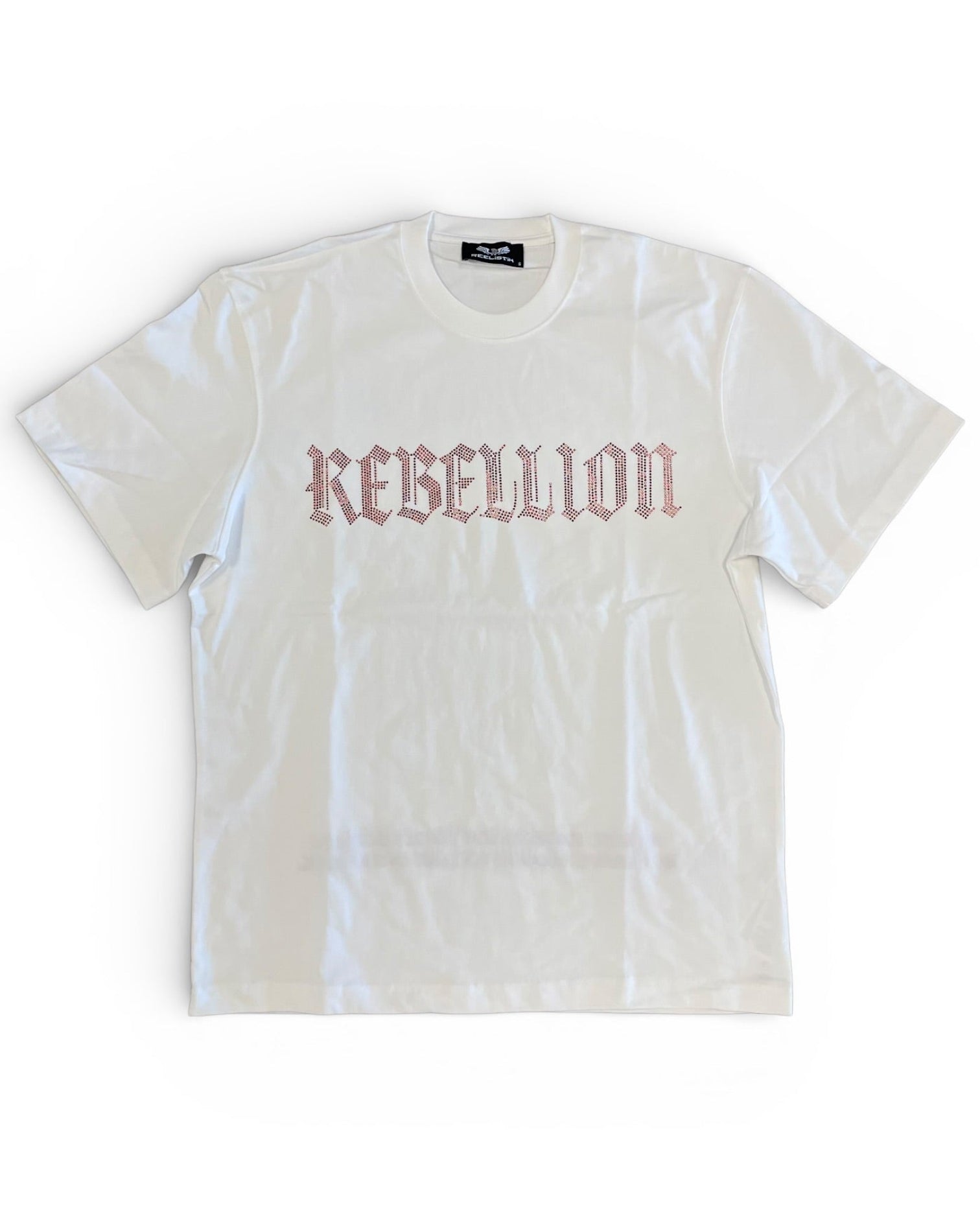 White t-shirt with 'REBELLION' RHIENSTONE text on a white background