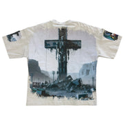T-shirt with a graphic design of a cross and landscape on a white background