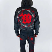 Black hoodie and pants with red design on a white background