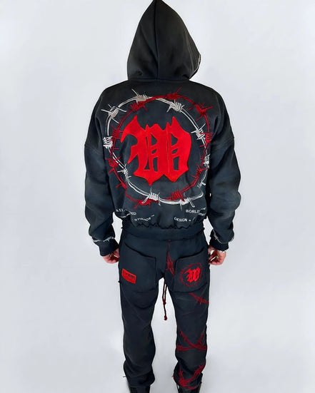 Black hoodie and pants with red design on a white background