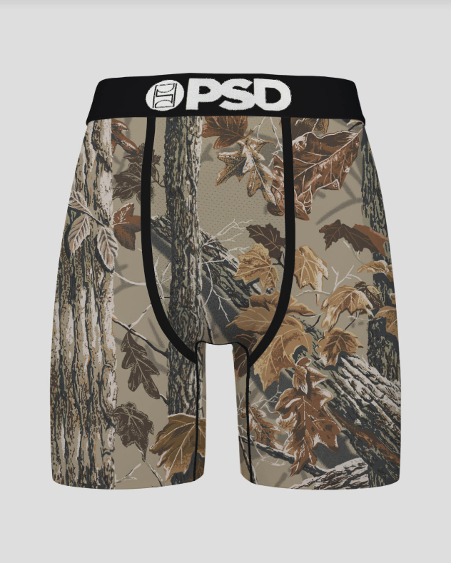 Camouflage-patterned underwear with a black waistband featuring 'PSD' branding on a gray background.