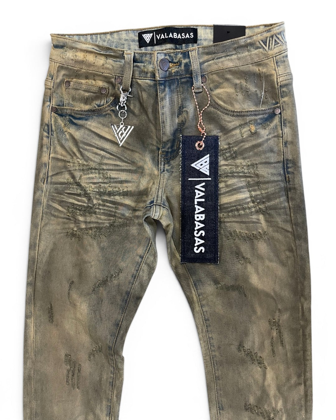 Worn jeans with visible branding on a white background
