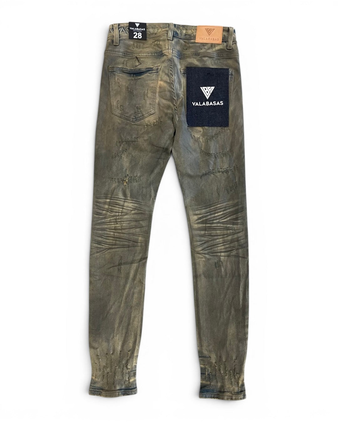 Worn green jeans with a visible brand logo on a white background