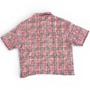Pink plaid shirt on a white background