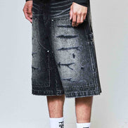 Person wearing a black and white outfit with a denim skirt, Nike shoes, and socks with text.