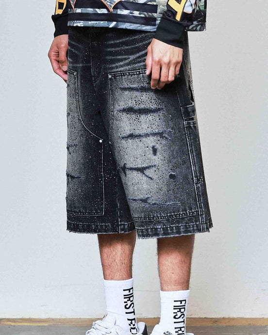 Person wearing a black and white outfit with a denim skirt, Nike shoes, and socks with text.