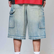 Person wearing a red jacket with 'Full Throttle' branding, blue denim shorts, and white sneakers on a plain background.