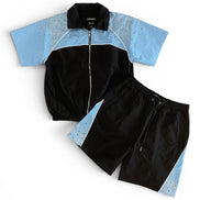Black and blue tracksuit with a white background