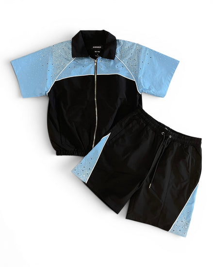 Black and blue tracksuit with a white background