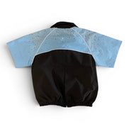 Black and blue baby romper on a white background