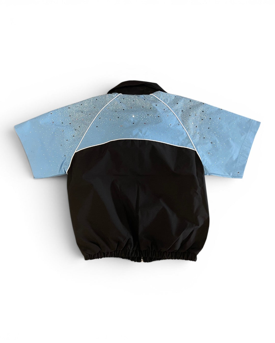 Black and blue baby romper on a white background