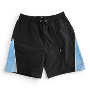 Black shorts with blue side panels on a white background