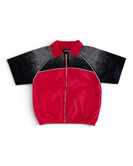 Red jacket with black speckled sleeves on a white background