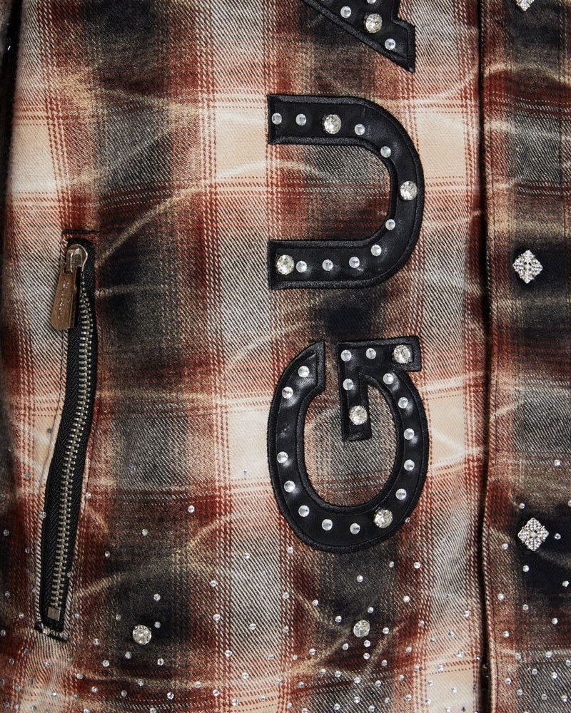 Plaid shirt with decorative elements and 'GUAPI' text on a brown background