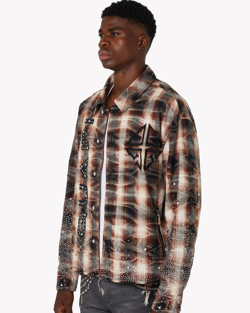 Man wearing a plaid shirt with a star design on a white background
