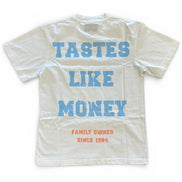 White t-shirt with blue and red text on a white background