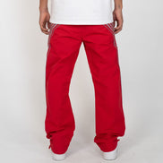 Red pants with white stripes on a plain background