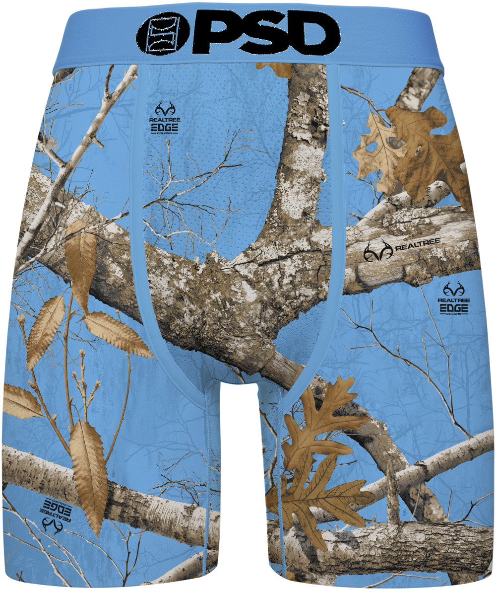 Blue camouflage boxer briefs featuring a Realtree Edge woodland camo pattern with branches, leaves, and bark, and a black 'PSD' logo printed on the front waistband.