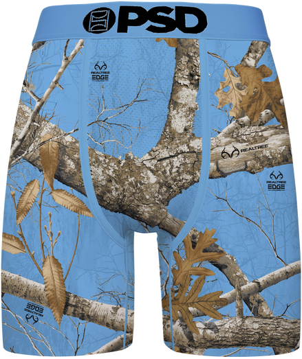 Blue camouflage boxer briefs featuring a Realtree Edge woodland camo pattern with branches, leaves, and bark, and a black 'PSD' logo printed on the front waistband.