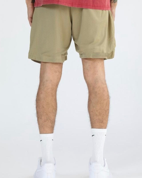 The back of the shorts are plain bone color with the netting being the main design.