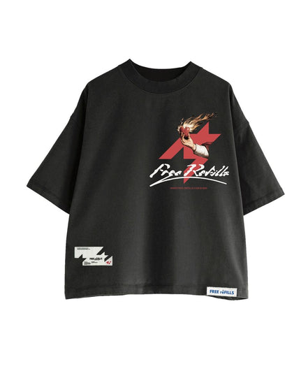 A black oversized short-sleeve t-shirt featuring a red and white graphic print on the front with the text 'Free Refills' and an anime character. It has a small white brand label on the bottom right hem and a small graphic patch on the bottom left hem, shown against a plain white background.