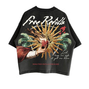 A black short-sleeve graphic t-shirt featuring a large vintage-style print on the back. The graphic depicts a hand holding a red heart amidst golden rays, flanked by green palm trees, with the text 'Free Refills' in white script at the top and 'www.free-refills.com'