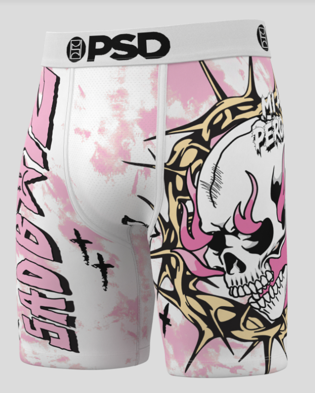 Pink and white shorts with skull design and 'PSD' branding on a gray background