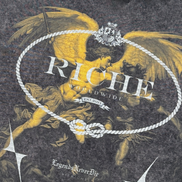 T-shirt with angel graphic and 'Richie' branding on a dark background