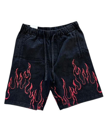 Black shorts with red flame patterns on a white background