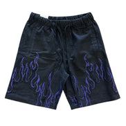 Black shorts with purple flame patterns on a white background