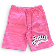 Pink shorts with a logo on a white background
